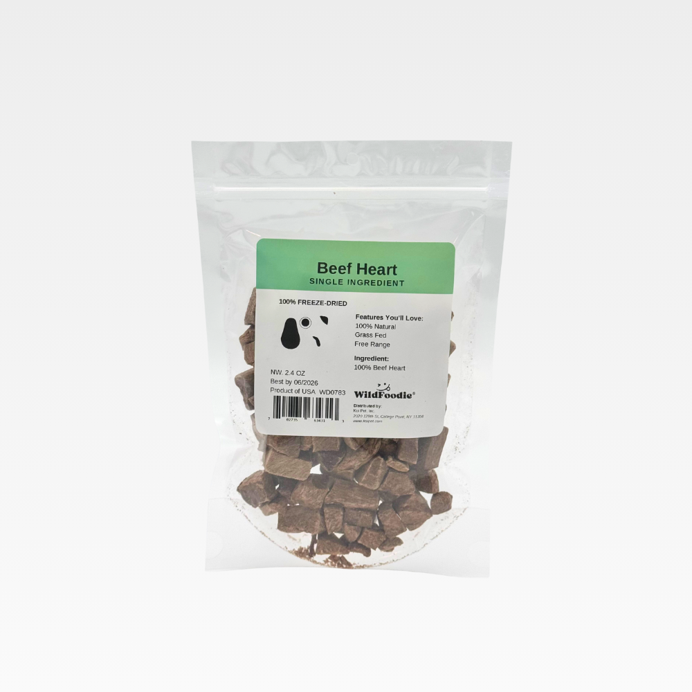 Freeze-dried beef heart cubes in dish with crumbs – WildFoodie natural dog treat Front package of WildFoodie Beef Heart 2.4oz – single ingredient dog treats Back view of freeze-dried beef heart cubes in resealable bag Size comparison of beef heart chunks with pencil – natural variation shown